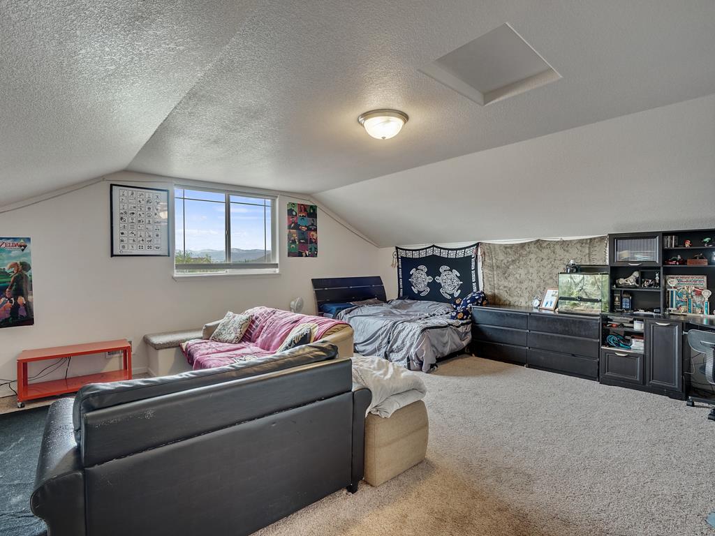 1853 Golden Ranch Road Fruita, CO 81521 - Photo 19 of 30 a bedroom with furniture and window
