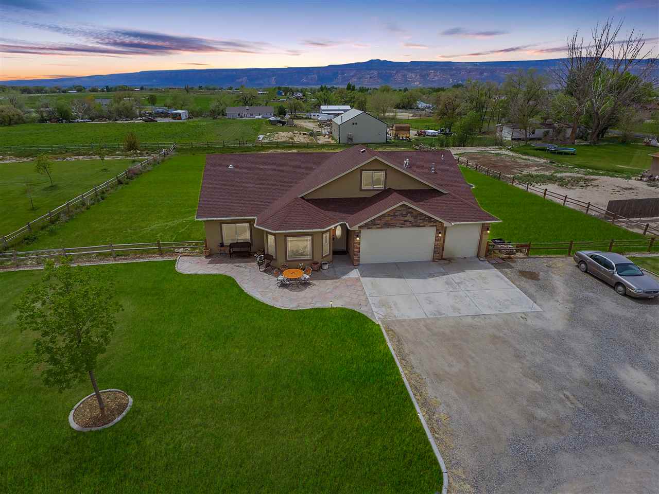 1853 Golden Ranch Road Fruita, CO 81521 - Photo 2 of 30 an aerial view of a house with pool a fire pit and yard