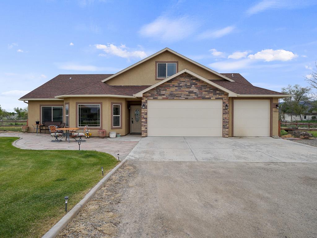 1853 Golden Ranch Road Fruita, CO 81521 - Photo 26 of 30 a front view of a house with swimming pool having outdoor seating