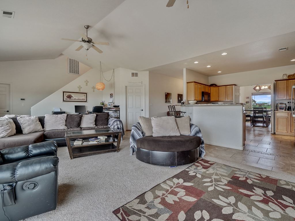 1853 Golden Ranch Road Fruita, CO 81521 - Photo 4 of 30 a living room with furniture and a wooden floor