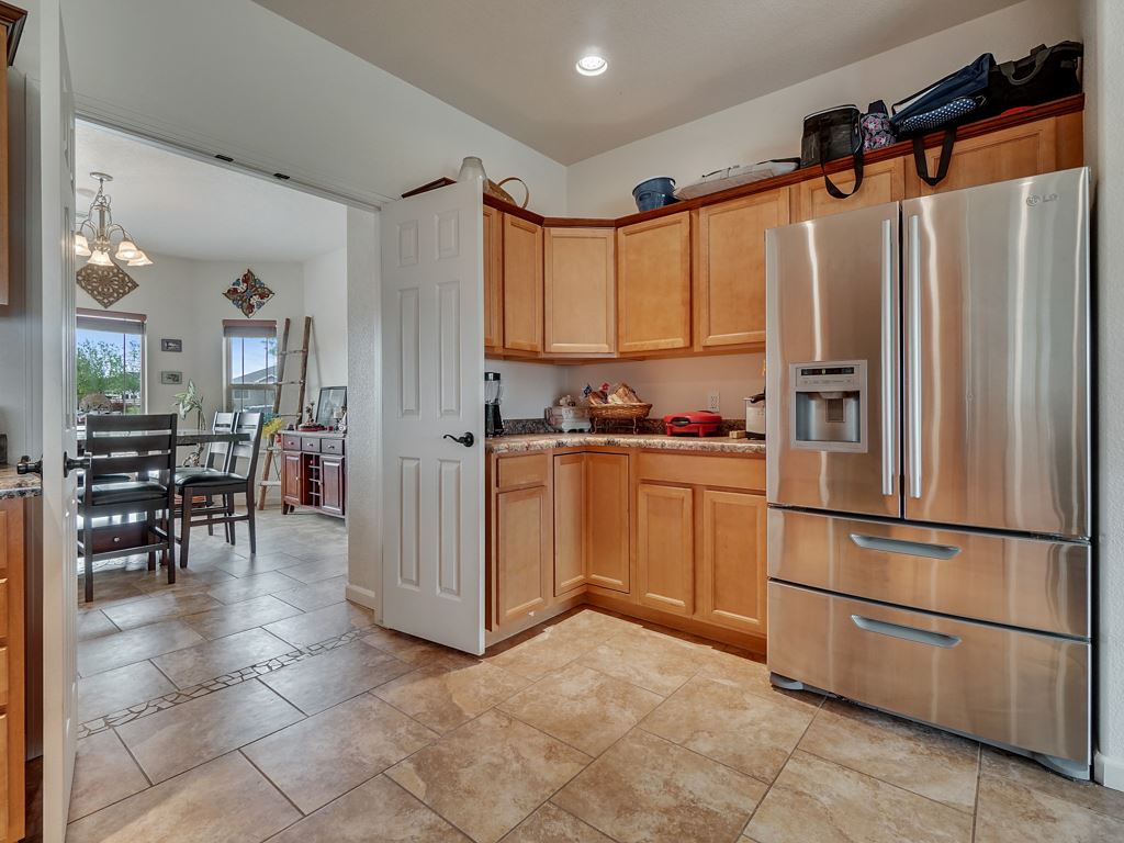 1853 Golden Ranch Road Fruita, CO 81521 - Photo 10 of 30 a kitchen with stainless steel appliances a refrigerator sink and cabinets