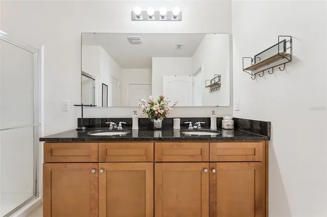 a kitchen with stainless steel appliances granite countertop cabinets and a counter top