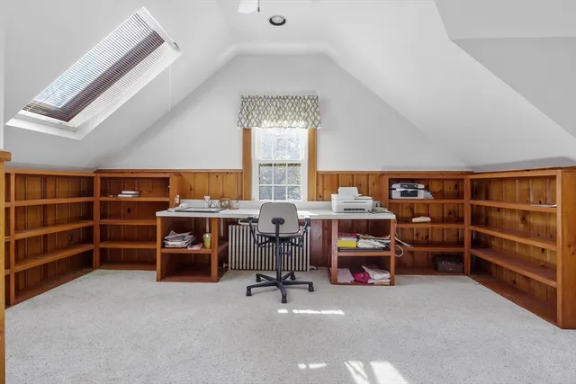 a view of a room with furniture and windows