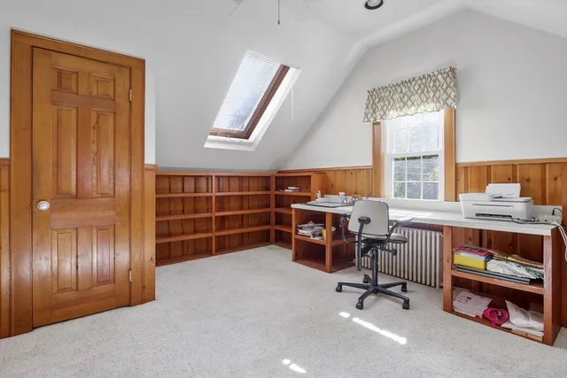 a view of a livingroom with furniture and a window