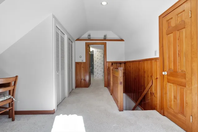 a view of a hallway with entryway door