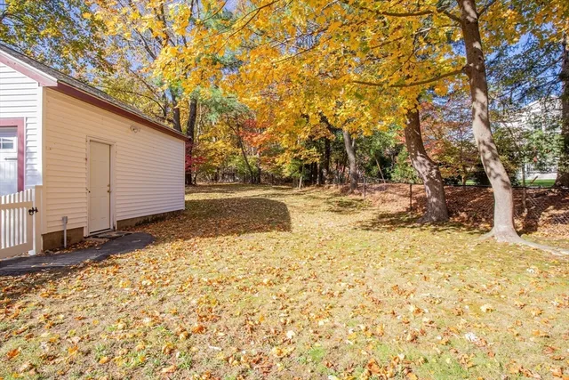 a view of a street with wooden fence and floor