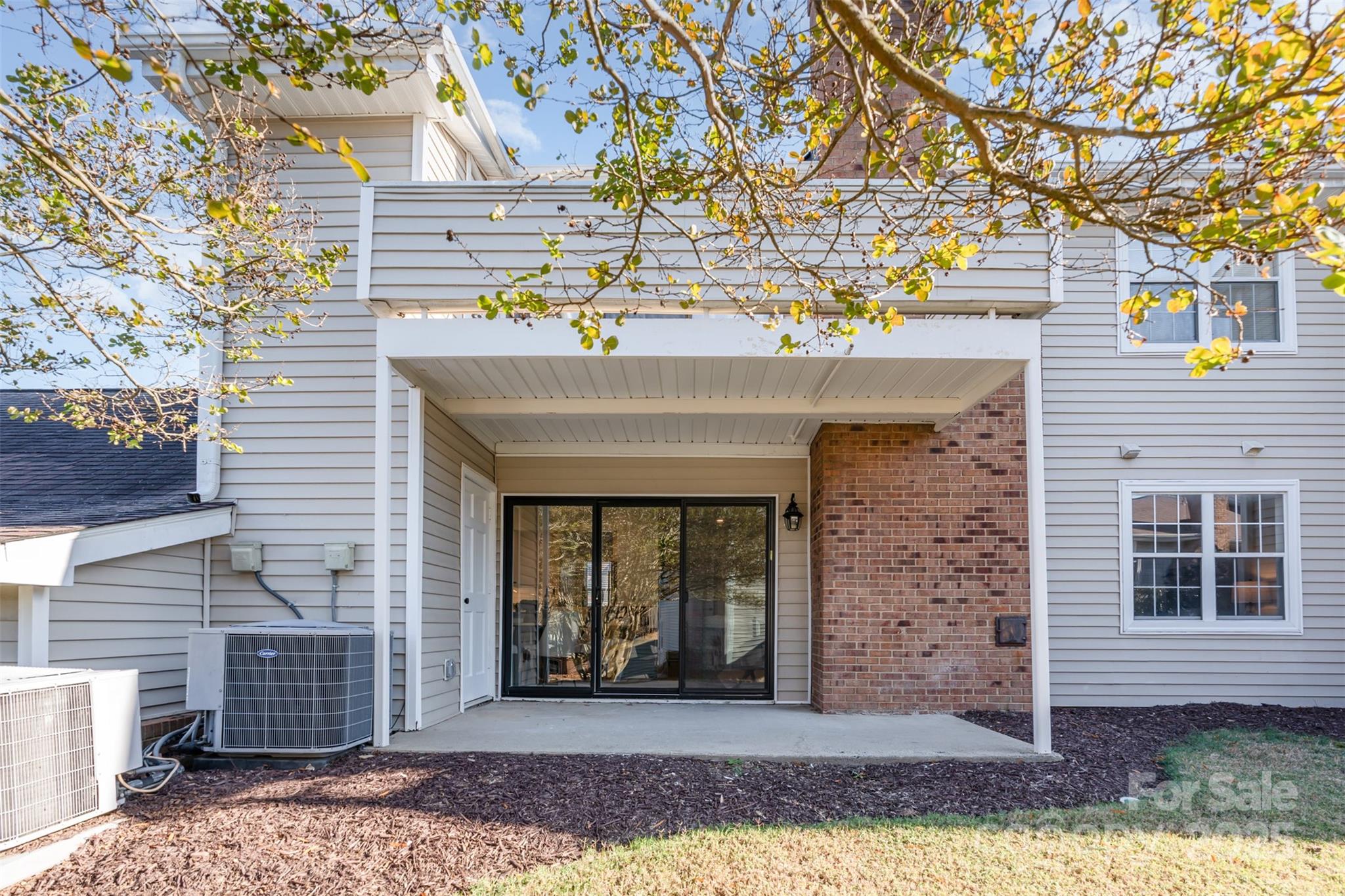 7802 Renaissance Court, Unit B Charlotte, NC 28226 - Photo 21 of 22 a front view of a house with a yard