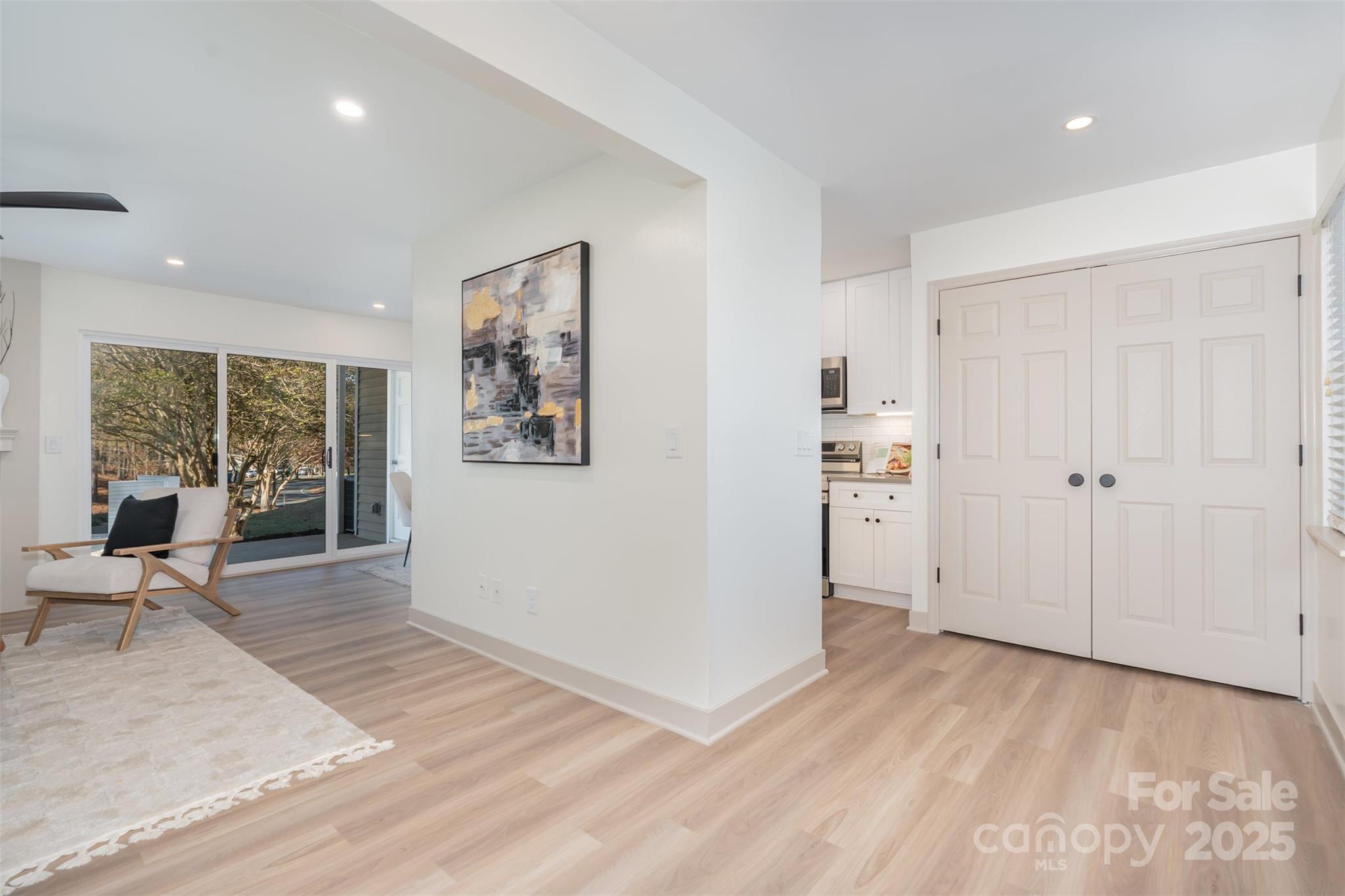 7802 Renaissance Court, Unit B Charlotte, NC 28226 - Photo 9 of 22 a view of a room with wooden floor and furniture