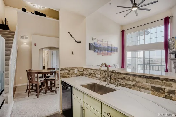 a kitchen with a sink and stove