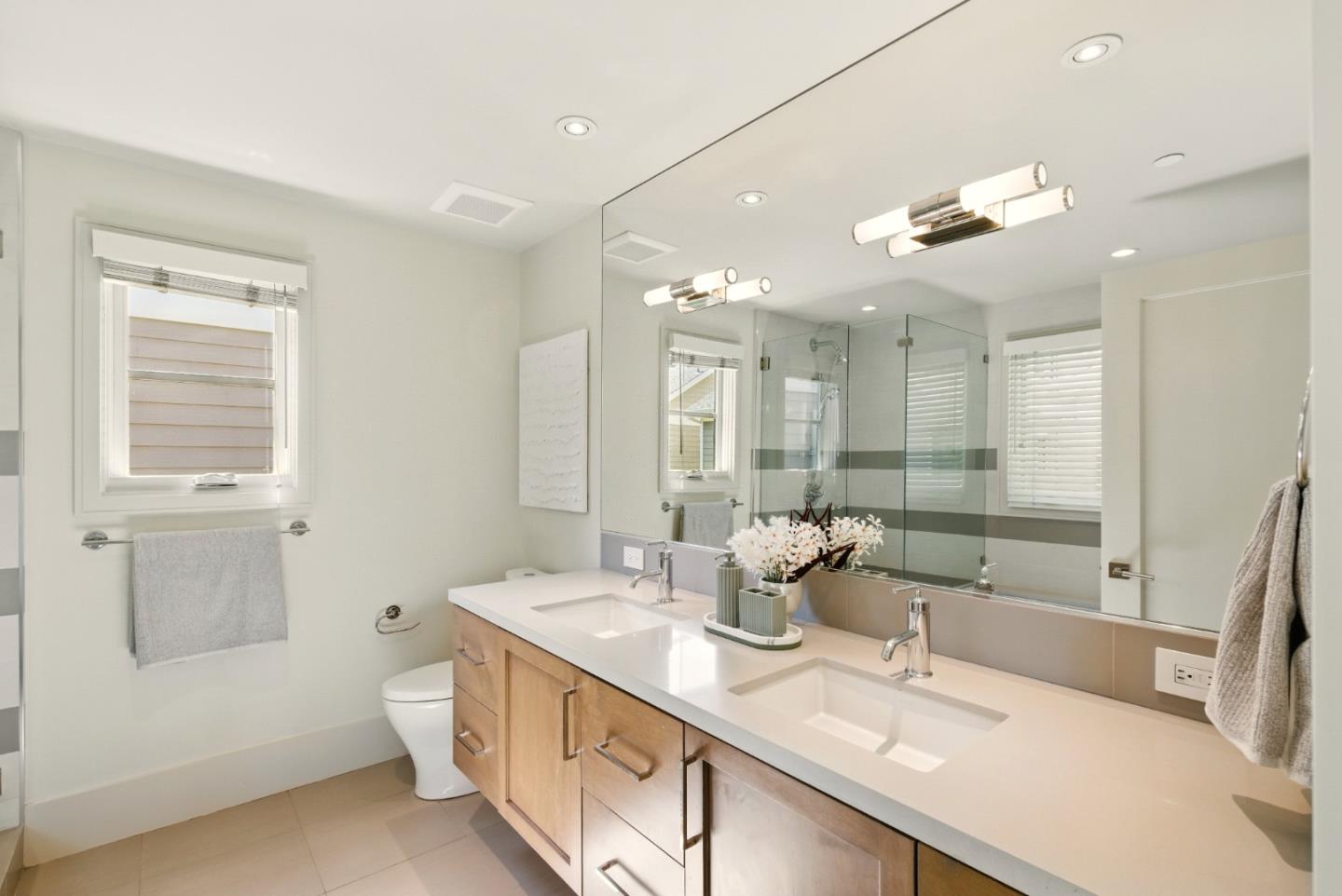 958 California Street Mountain View, CA 94041 - Photo 11 of 25 a bathroom with a double vanity sink a mirror and a shower