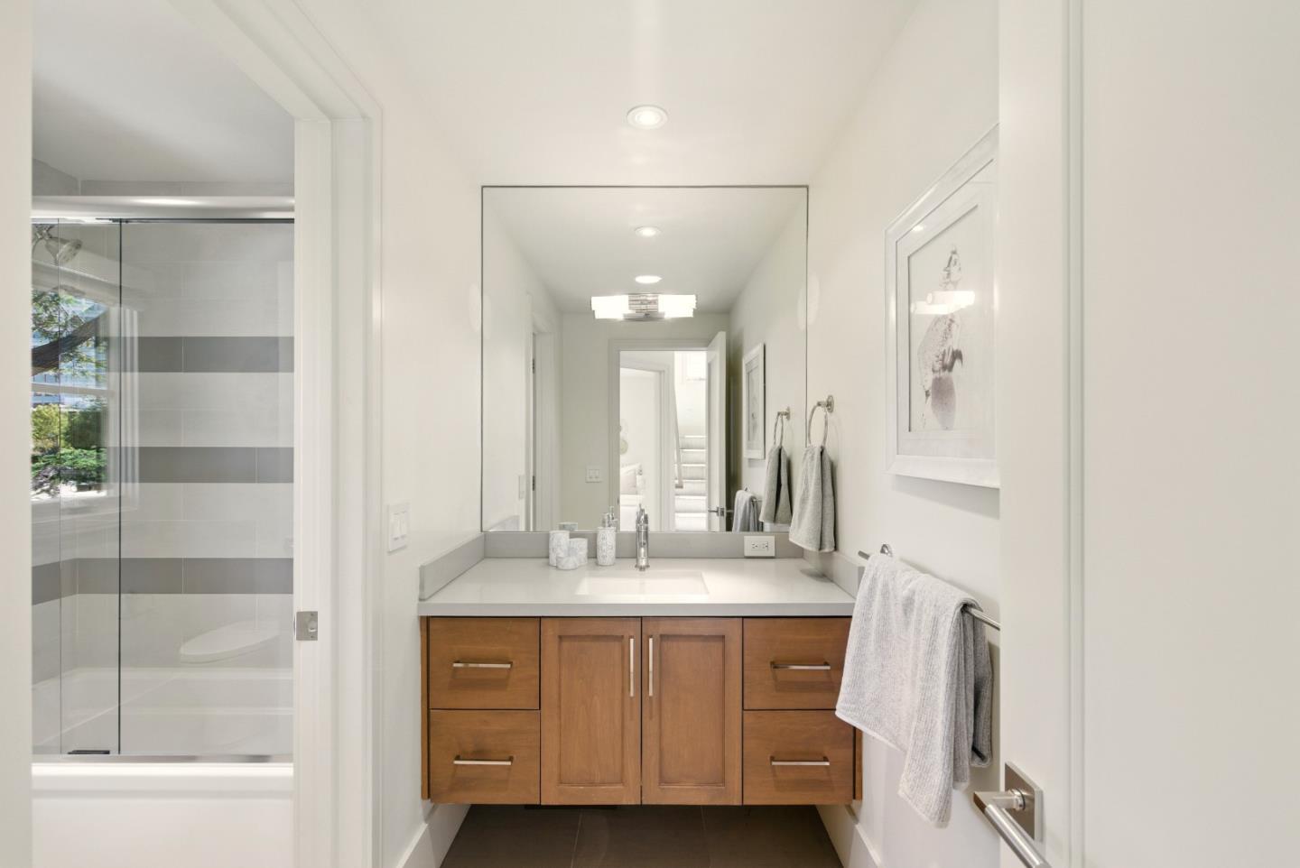 958 California Street Mountain View, CA 94041 - Photo 16 of 25 a bathroom with a double vanity sink mirror and shower
