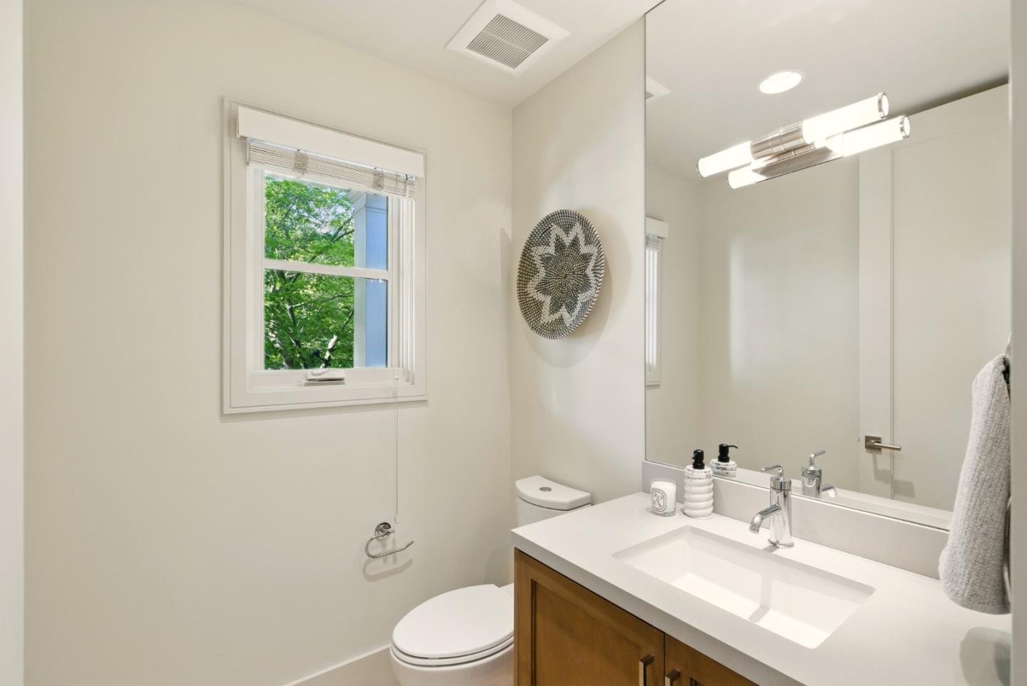 958 California Street Mountain View, CA 94041 - Photo 18 of 25 a bathroom with a sink vanity mirror and toilet