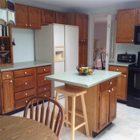357 Glendale Road Hampden, MA 01036 - Photo 10 of 30 a kitchen with stainless steel appliances kitchen island granite countertop a table chairs in it and a window