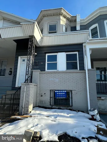 a front view of a house with a garage