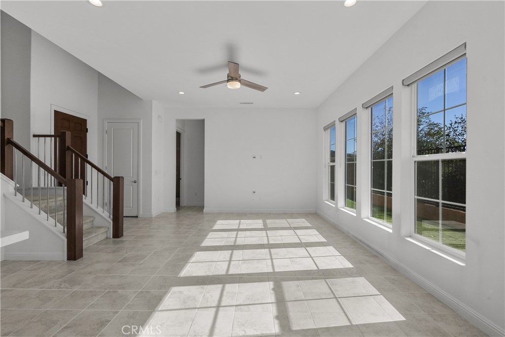 20828 Bur Oak Circle Porter Ranch, CA 91326 - Photo 11 of 43 a view of a hallway with wooden floor and windows
