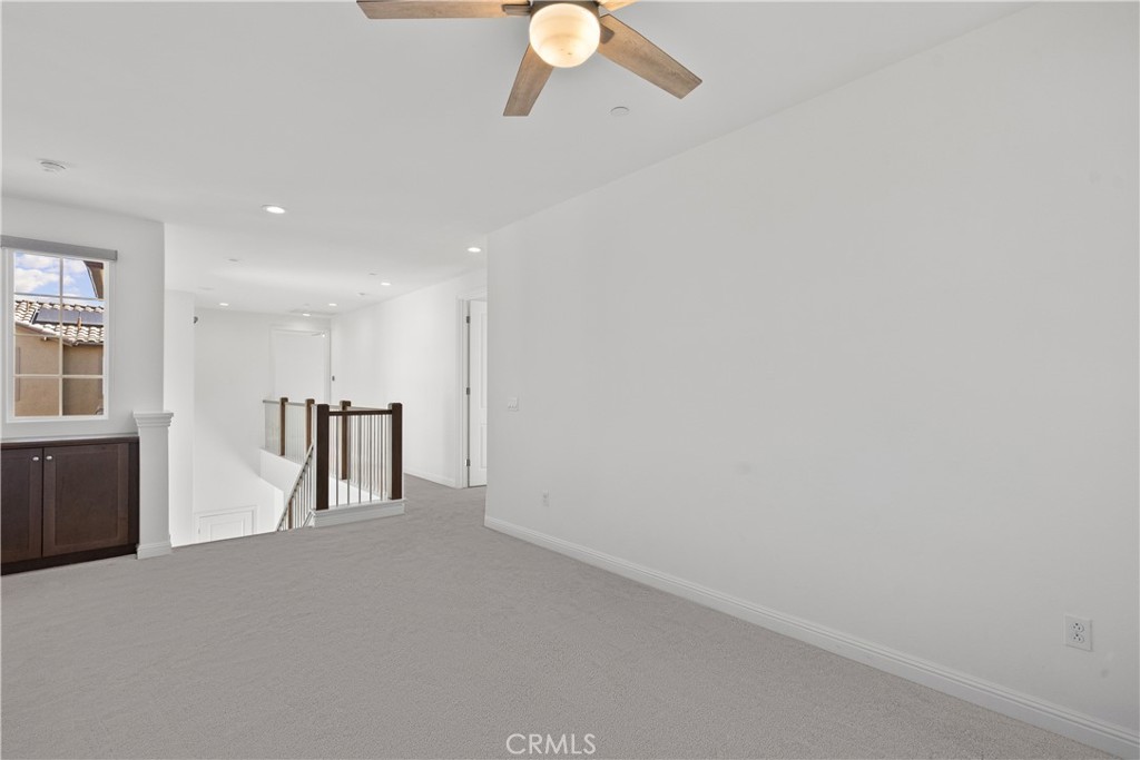 20828 Bur Oak Circle Porter Ranch, CA 91326 - Photo 18 of 43 a view of empty room with wooden floor