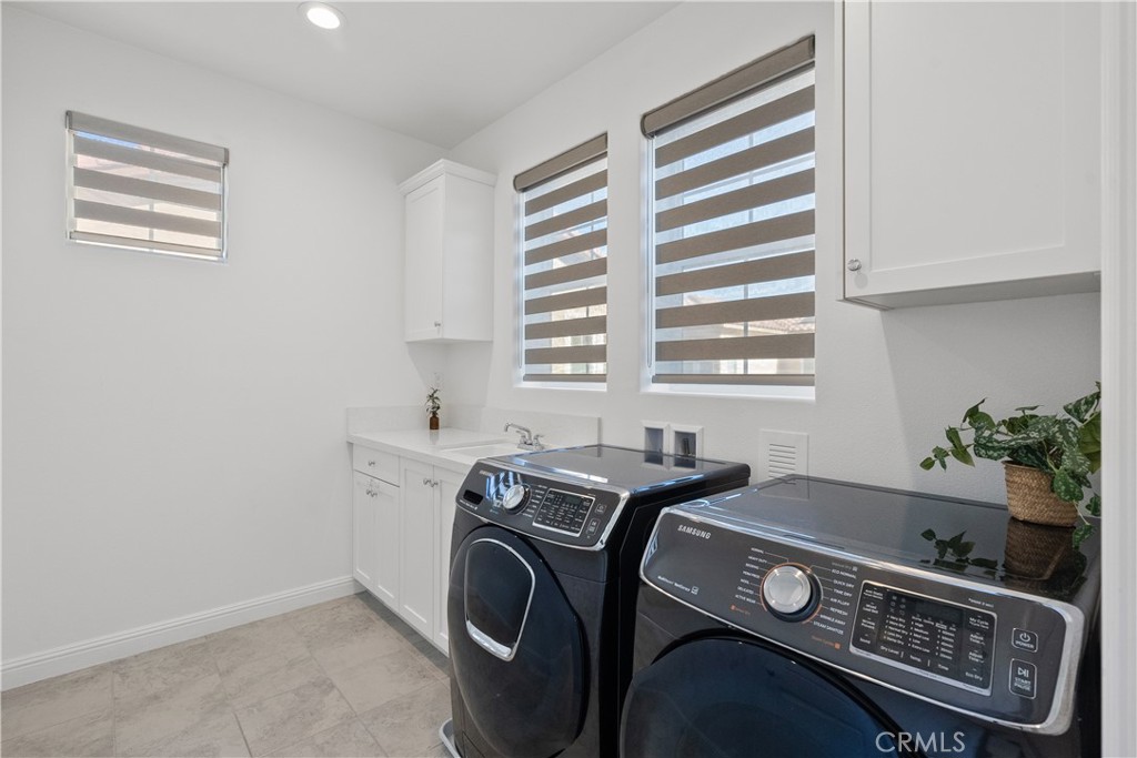 20828 Bur Oak Circle Porter Ranch, CA 91326 - Photo 20 of 43 a view of a kitchen with washer and dryer