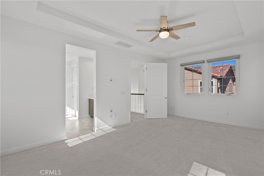 20828 Bur Oak Circle Porter Ranch, CA 91326 - Photo 27 of 43 a view of an empty room with a ceiling fan