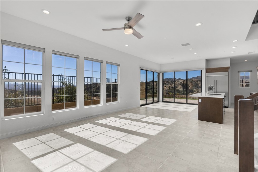 20828 Bur Oak Circle Porter Ranch, CA 91326 - Photo 3 of 43 a view of an empty room with wooden floor and a window