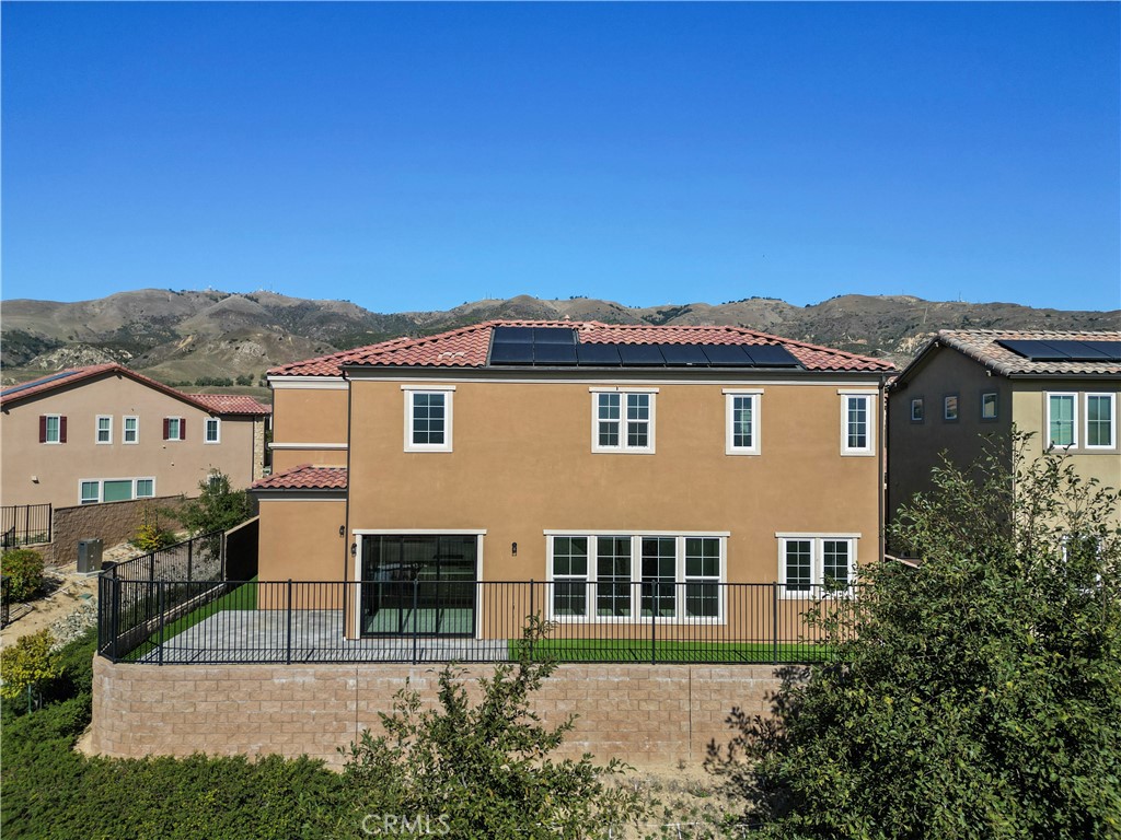 20828 Bur Oak Circle Porter Ranch, CA 91326 - Photo 36 of 43 a front view of a house with a yard