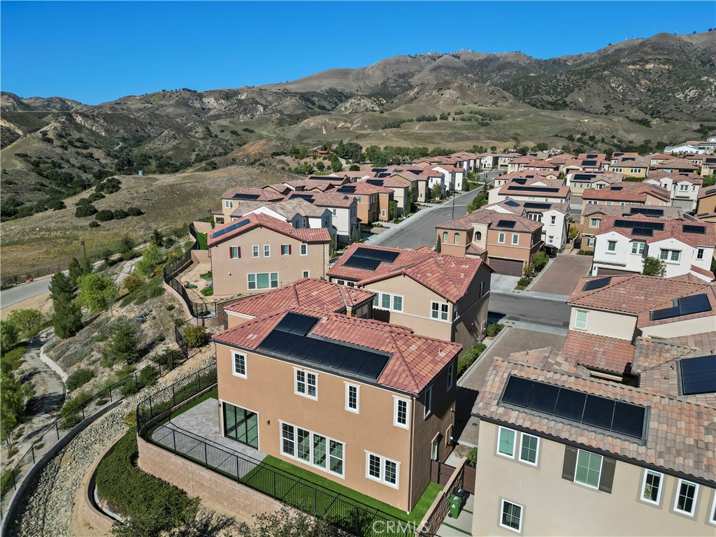 20828 Bur Oak Circle Porter Ranch, CA 91326 - Photo 43 of 43 an aerial view of a house with a mountain