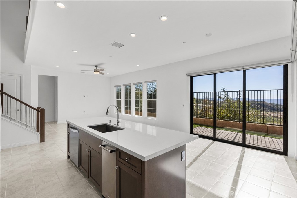 20828 Bur Oak Circle Porter Ranch, CA 91326 - Photo 8 of 43 a kitchen with stainless steel appliances granite countertop a sink and a refrigerator