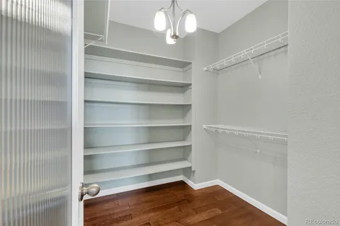 a view of a room with wooden floor and staircase