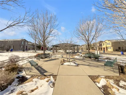 a view of a yard with cars