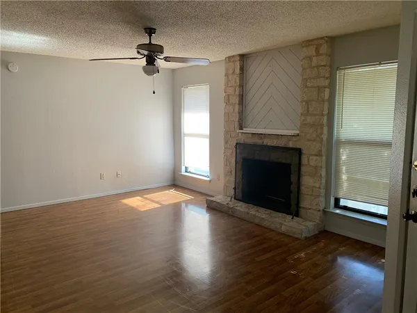 a kitchen with a stove a refrigerator and a cabinets