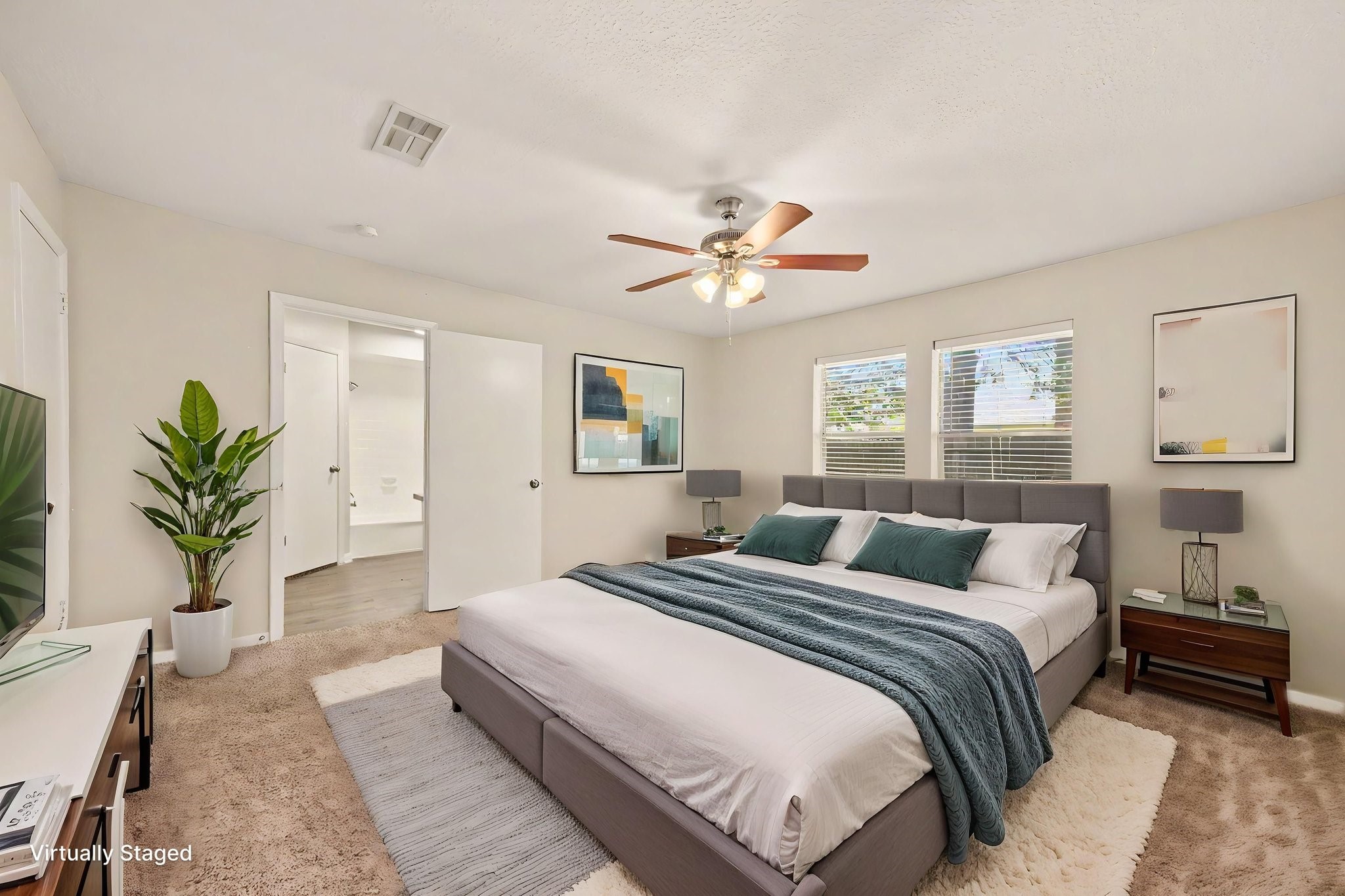 17419 Cassina Drive Spring, TX 77388 - Photo 19 of 35 a bedroom with bed and a chandelier