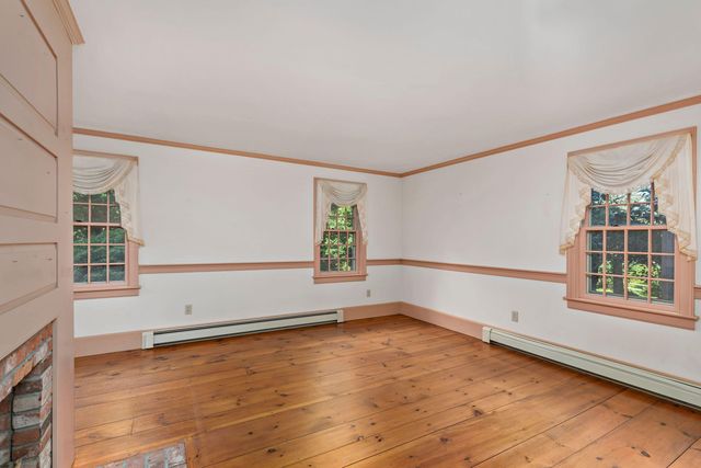 a bathroom with a sink toilet and mirror