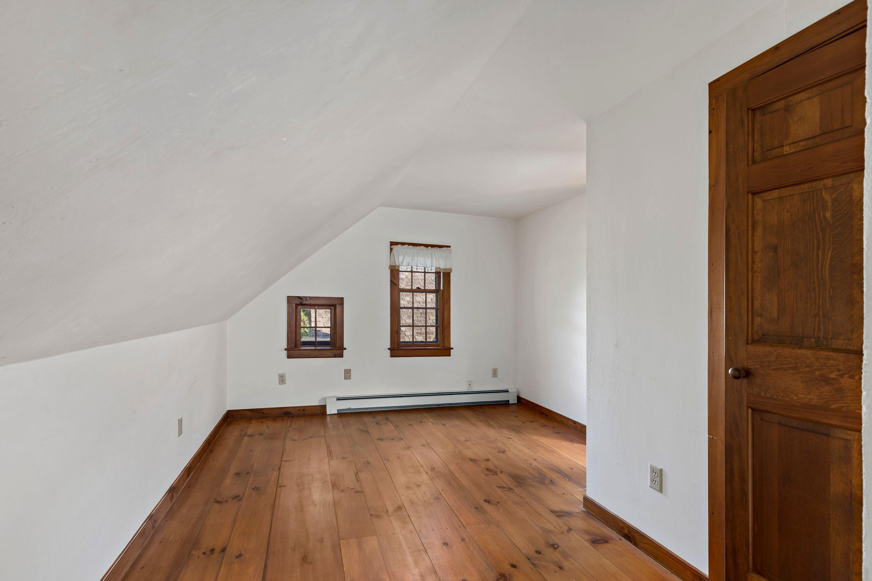 80 Red Wing Lane Barnstable, MA 02630 - Photo 28 of 37 an empty room with wooden floor and windows