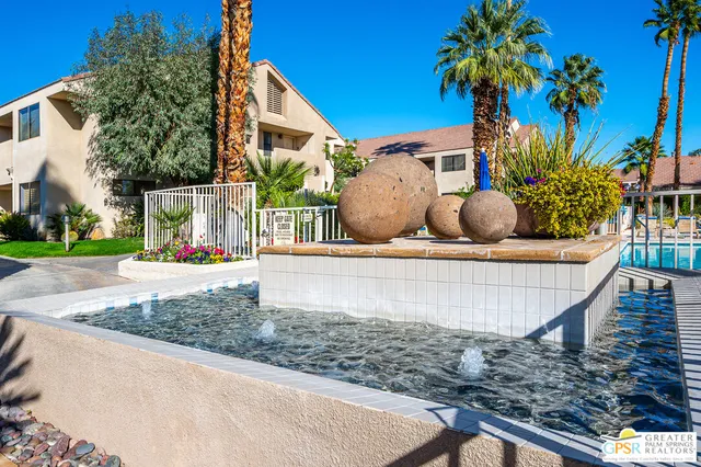 a view of a tall building in the backyard