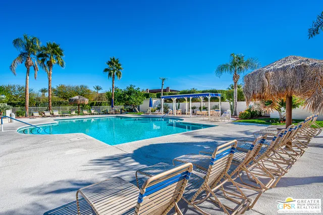a view of a swimming pool with a patio