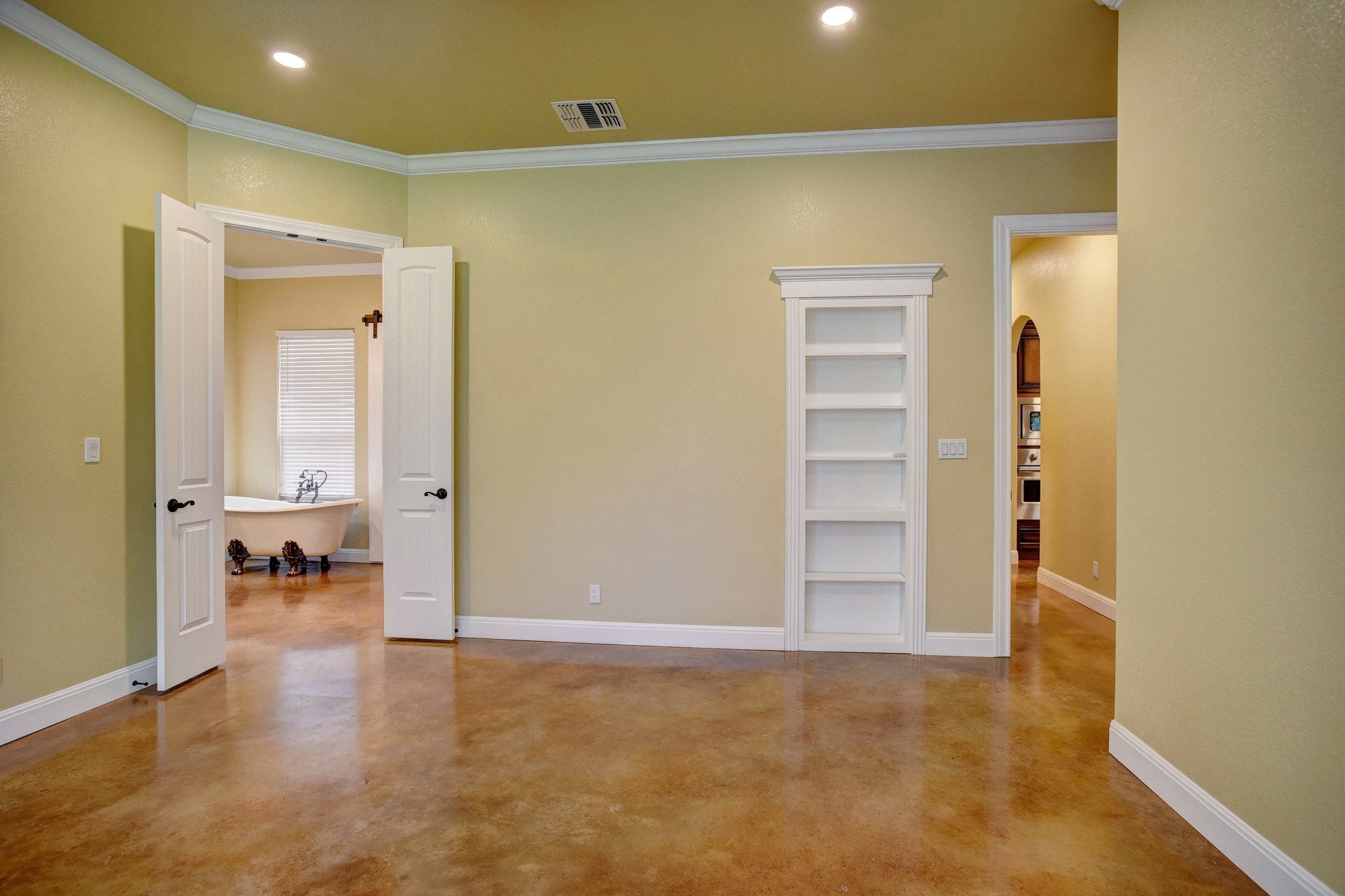 115 Pine Point Cove Elgin, TX 78621 - Photo 20 of 39 Natural light illuminates the smooth concrete floors, creating an inviting and tranquil atmosphere.
