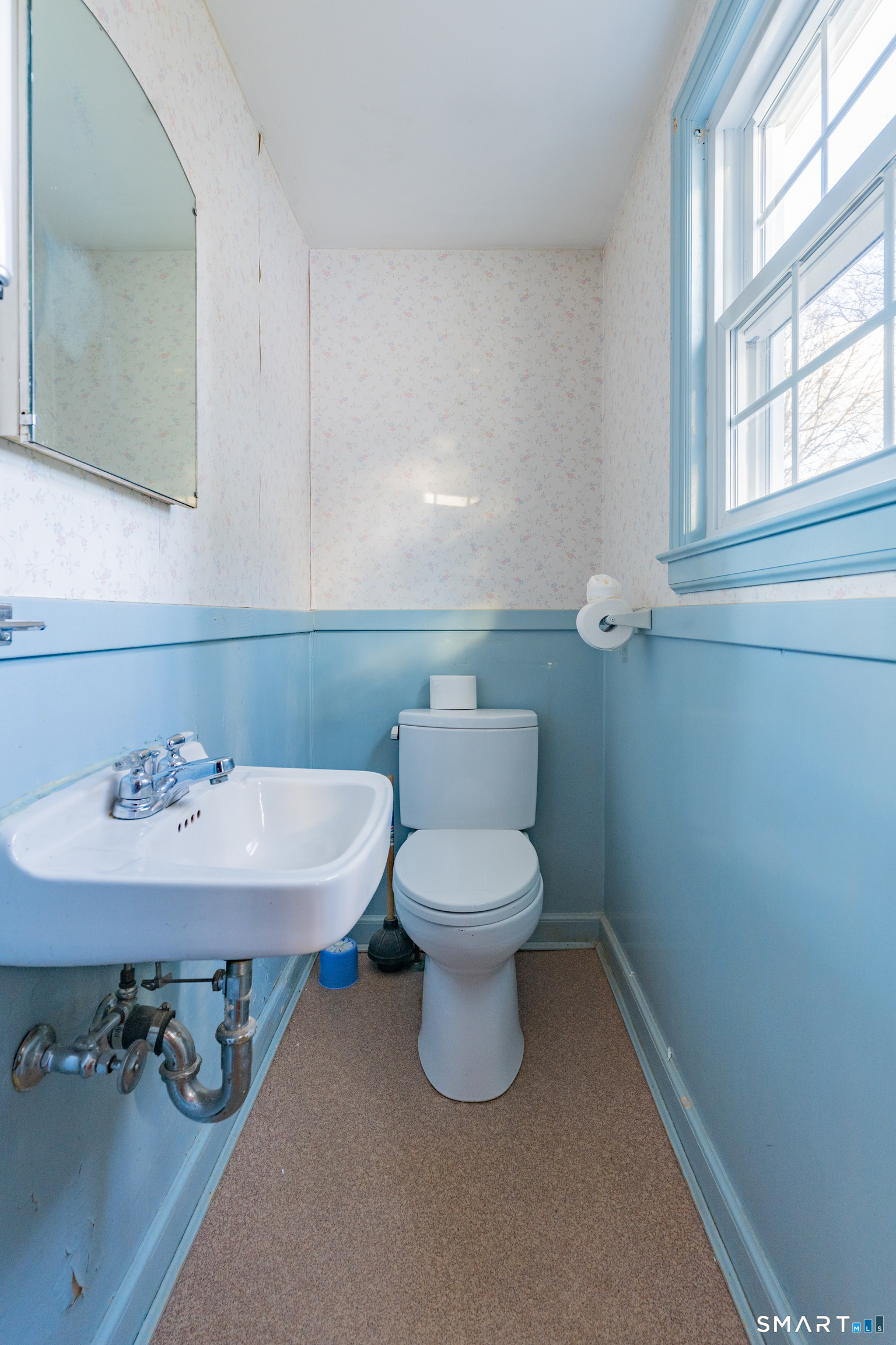 38 Wheeler Road Wethersfield, CT 06109 - Photo 3 of 28 a bathroom with a sink a toilet and a mirror