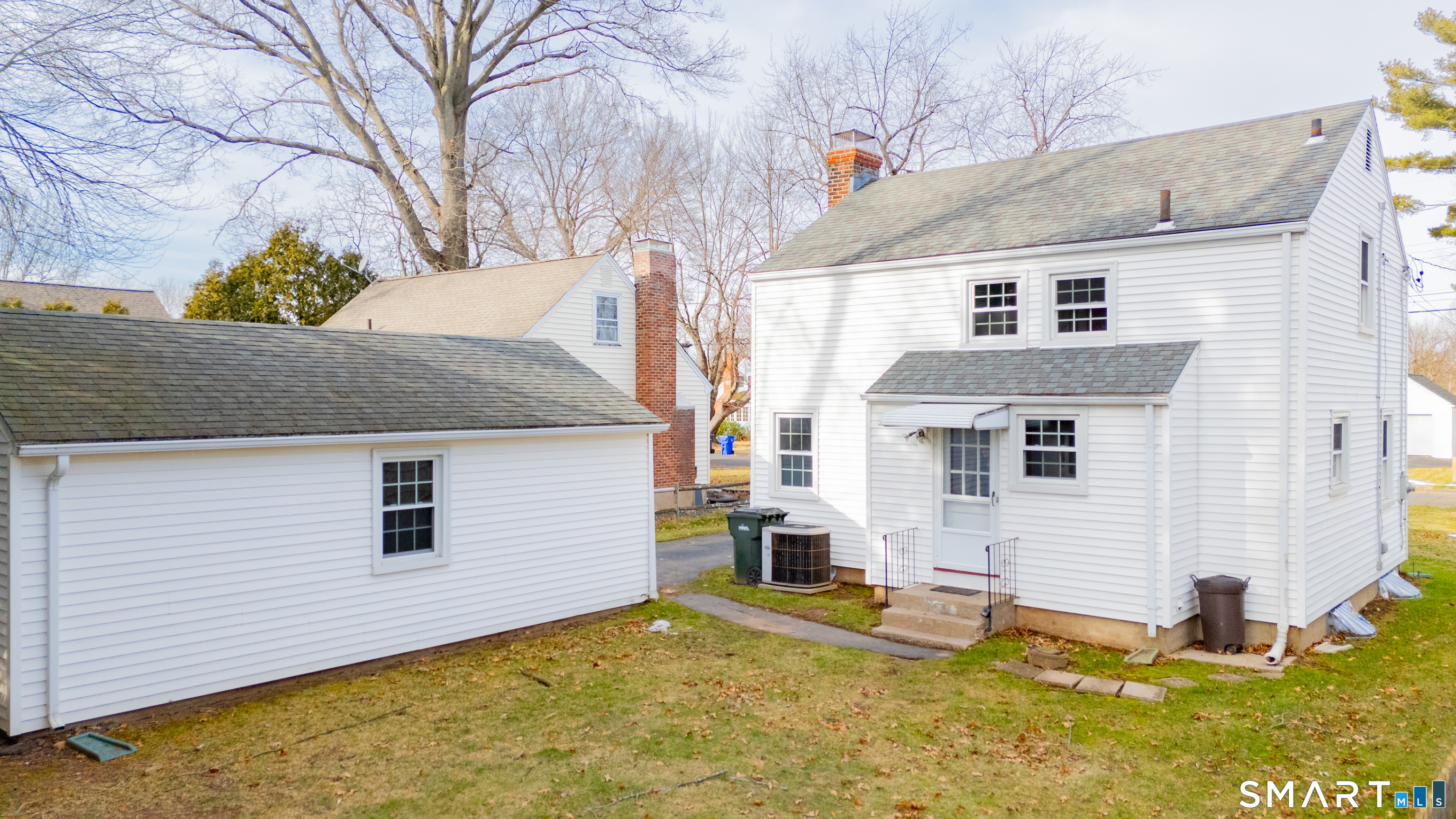 38 Wheeler Road Wethersfield, CT 06109 - Photo 10 of 28 a view of a house with a yard and garage