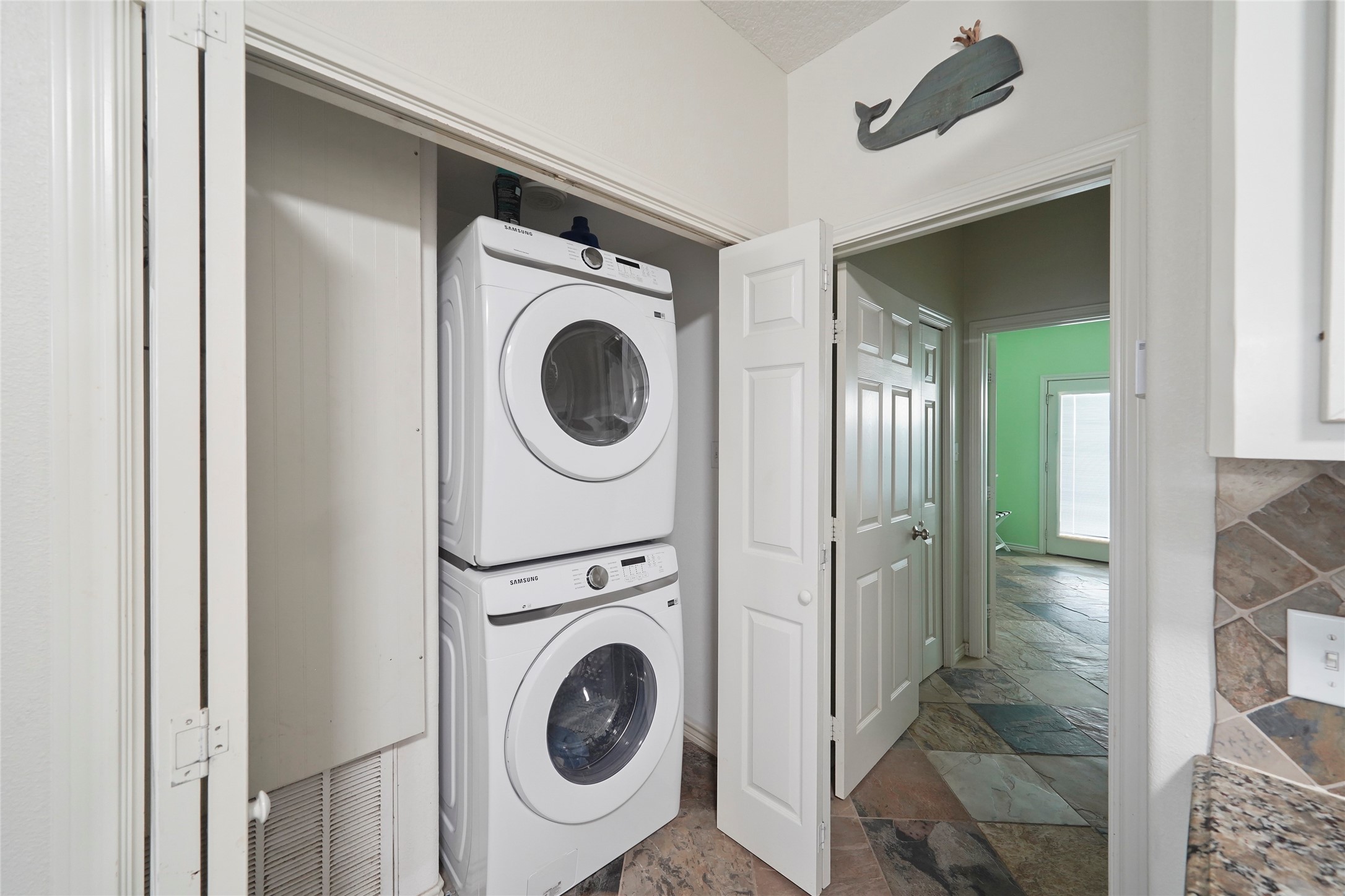 143 Boat Slip Road Matagorda, TX 77457 - Photo 11 of 31 a view of a hallway with washer and dryer