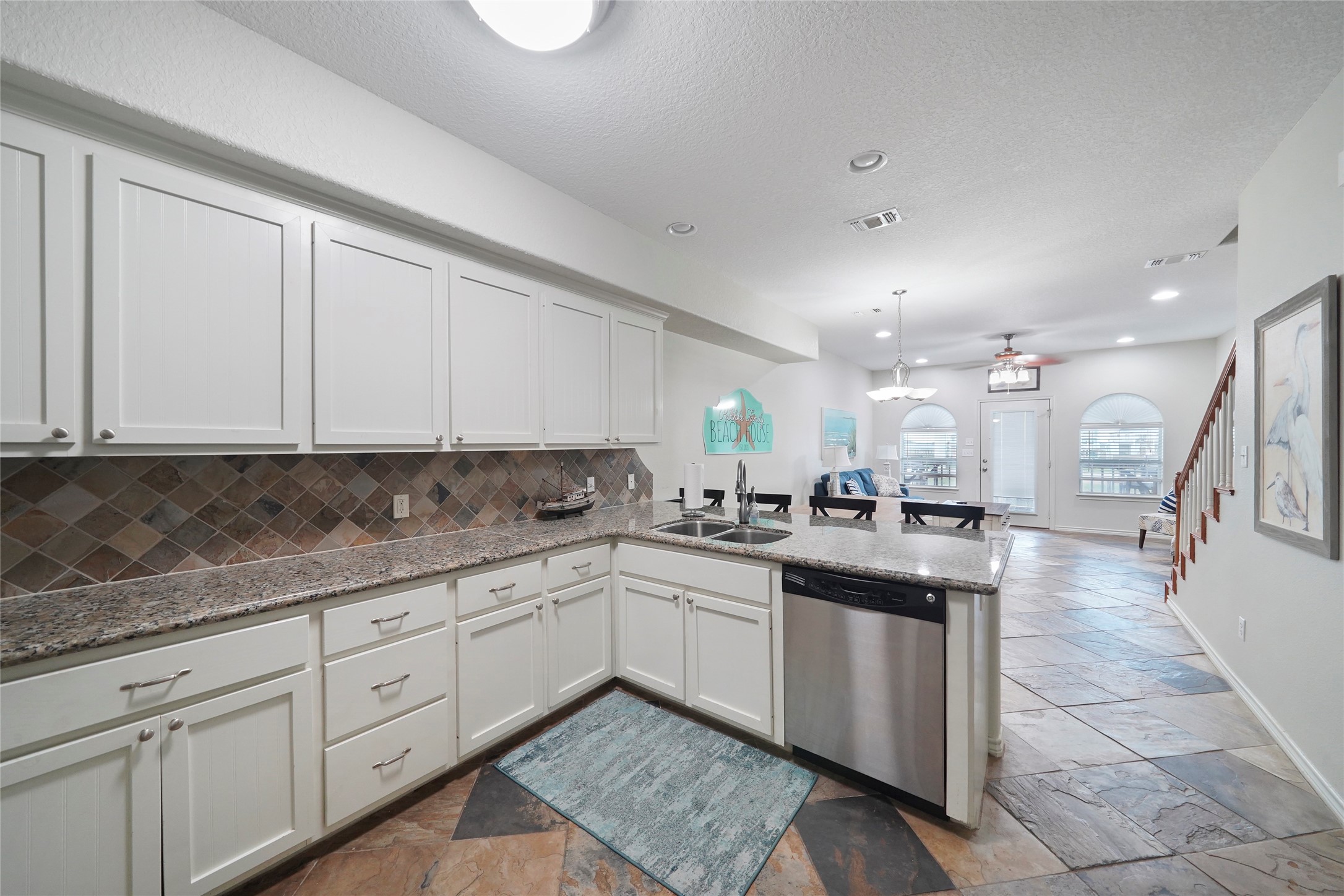 143 Boat Slip Road Matagorda, TX 77457 - Photo 13 of 31 a kitchen with counter top space sink and cabinets