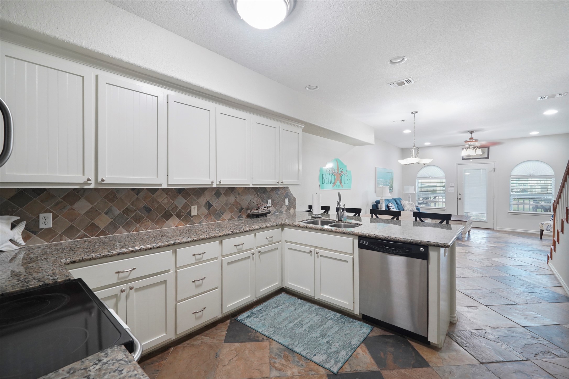 143 Boat Slip Road Matagorda, TX 77457 - Photo 16 of 31 a kitchen with a sink and cabinets