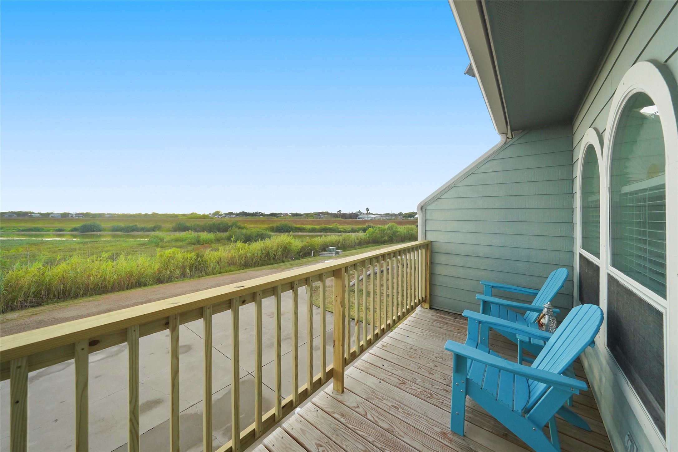 143 Boat Slip Road Matagorda, TX 77457 - Photo 20 of 31 a view of a balcony with wooden floor and outdoor space