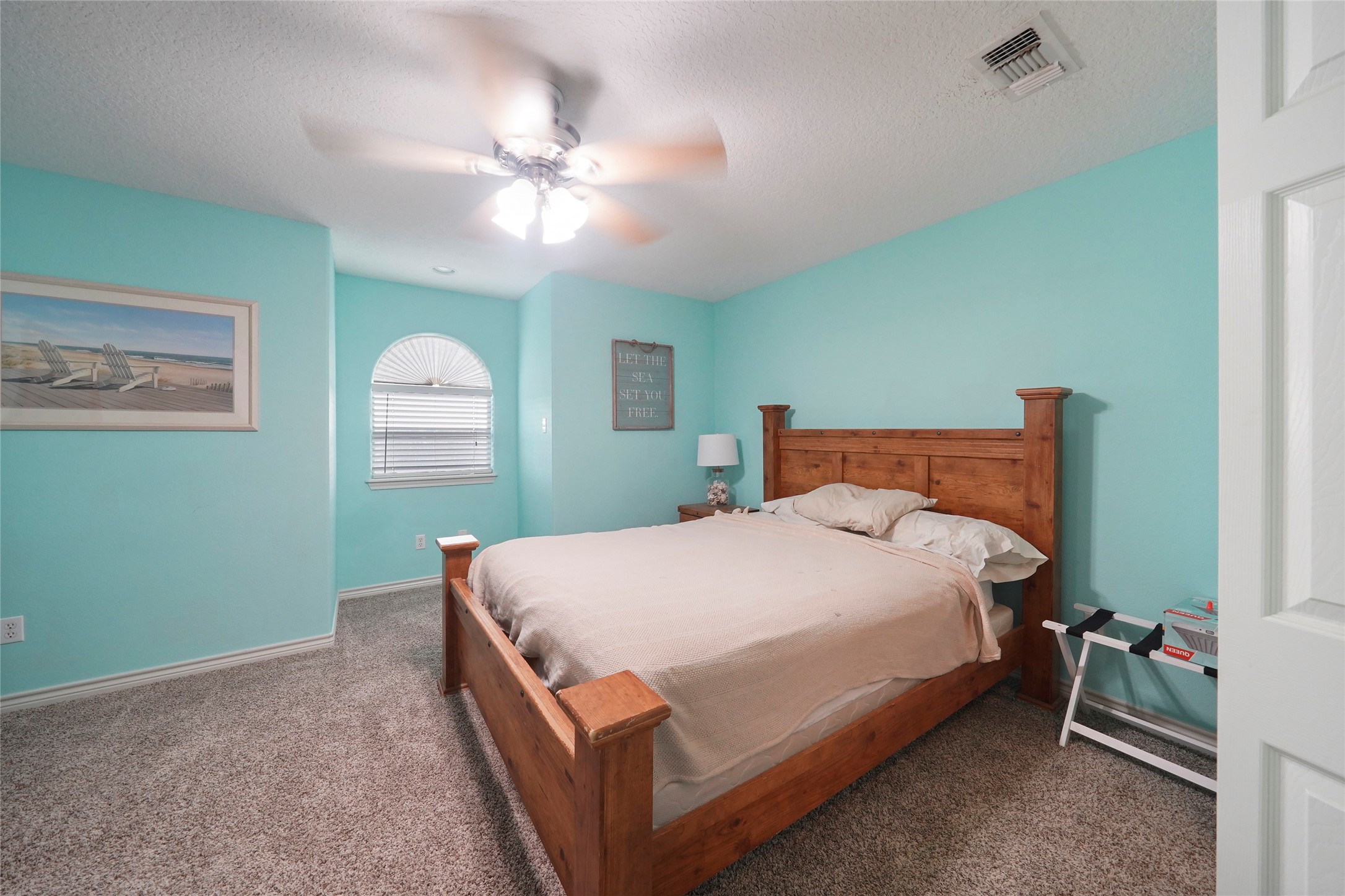143 Boat Slip Road Matagorda, TX 77457 - Photo 21 of 31 a bedroom with a bed and window