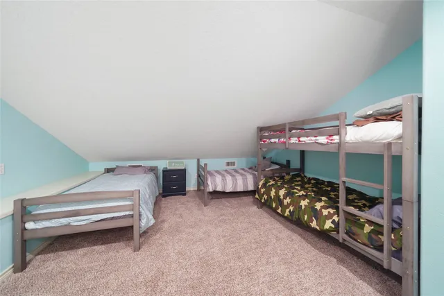 a aerial view of a house with a yard and sitting area