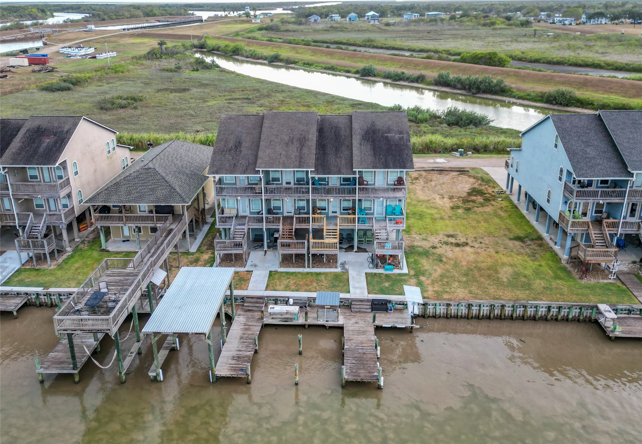 143 Boat Slip Road Matagorda, TX 77457 - Photo 27 of 31 a aerial view of a house with a yard and sitting area