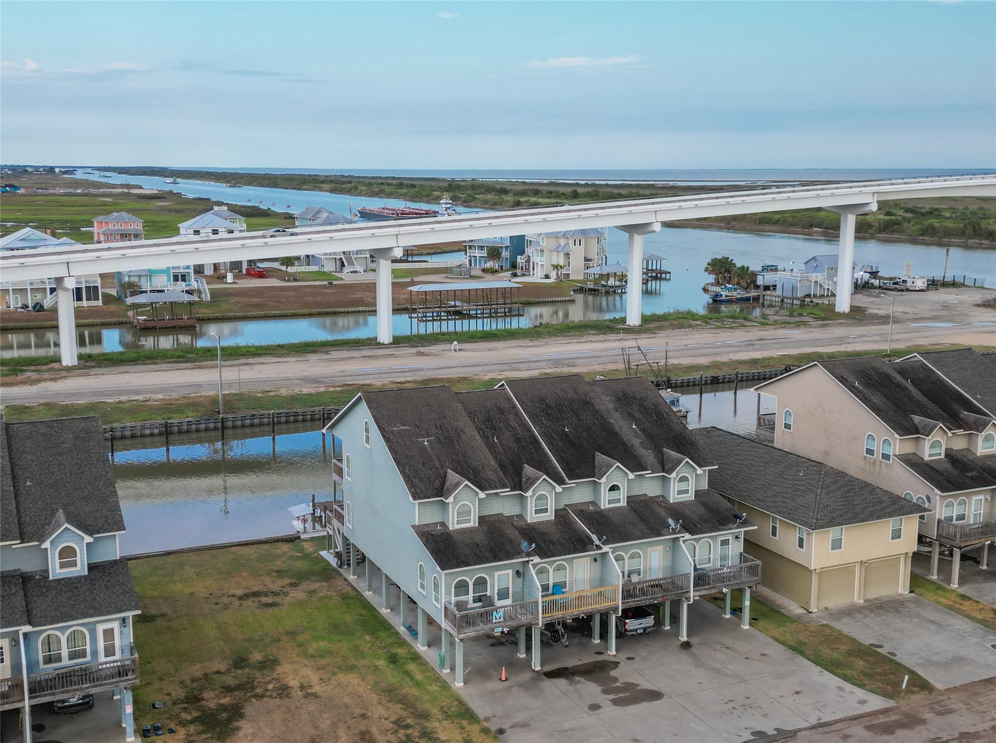 143 Boat Slip Road Matagorda, TX 77457 - Photo 3 of 31 a view of a swimming pool with a chairs