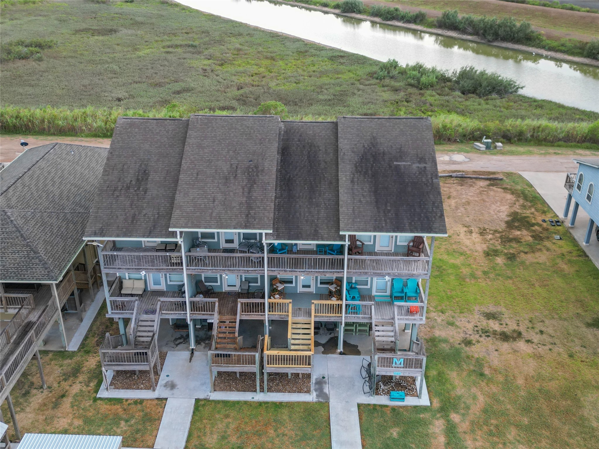143 Boat Slip Road Matagorda, TX 77457 - Photo 4 of 31 a bird view of a house with a yard