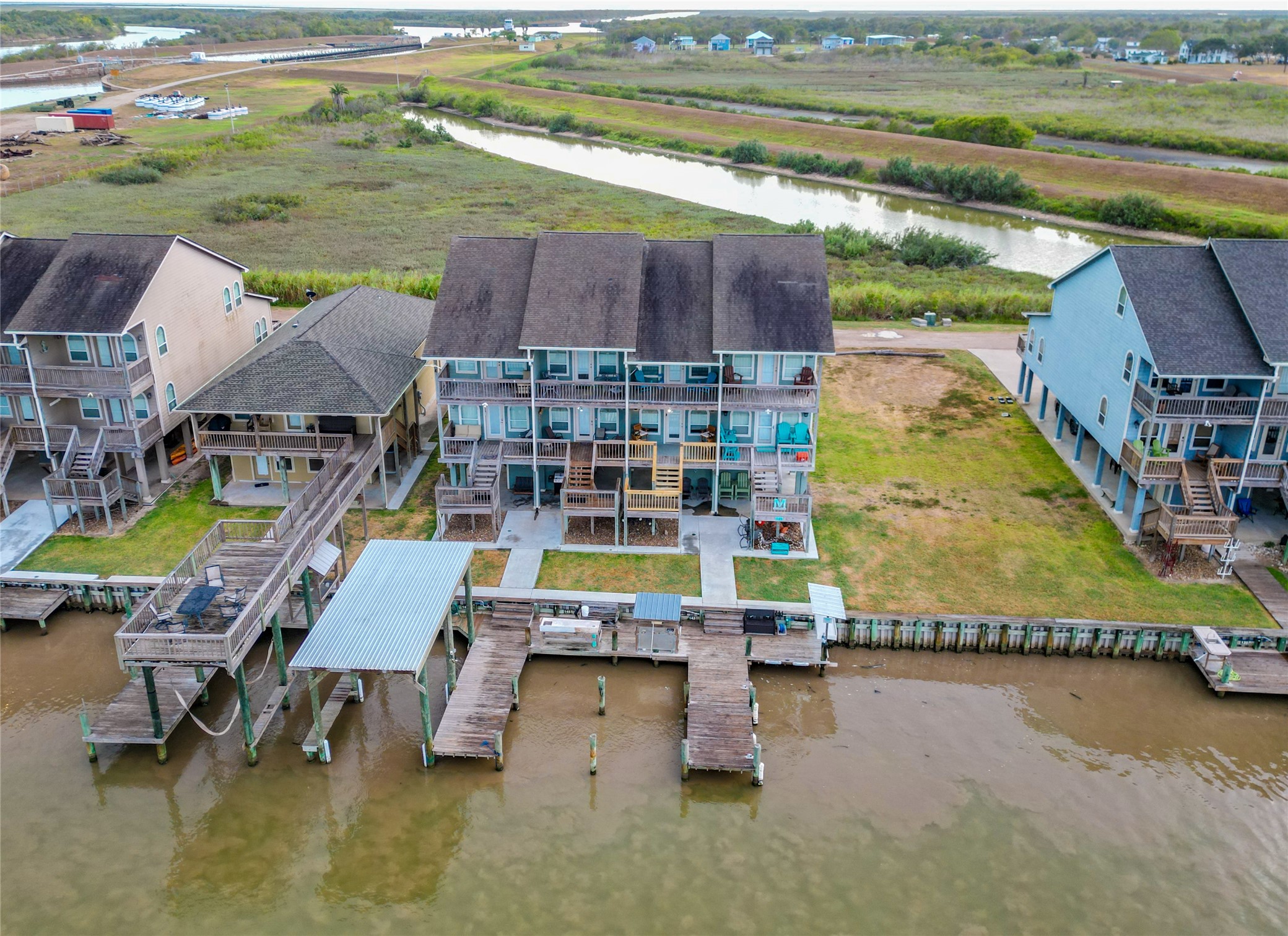 143 Boat Slip Road Matagorda, TX 77457 - Photo 5 of 31 a aerial view of houses with outdoor space and swimming pool