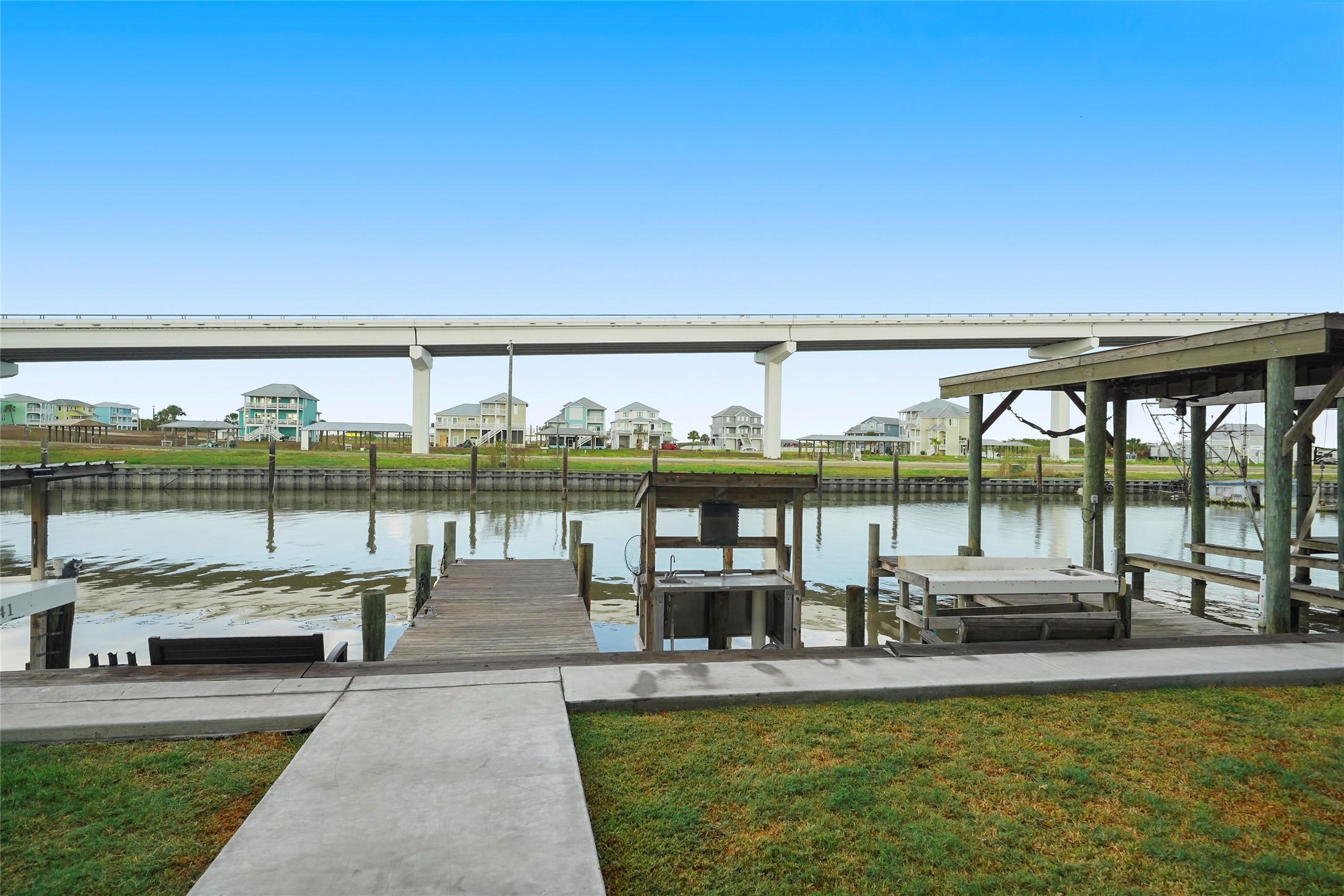 143 Boat Slip Road Matagorda, TX 77457 - Photo 6 of 31 a view of a swimming pool and couches in the patio