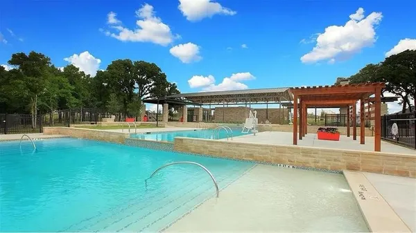 a view of swimming pool with a yard