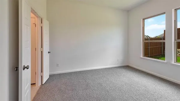 a kitchen with a refrigerator and a sink
